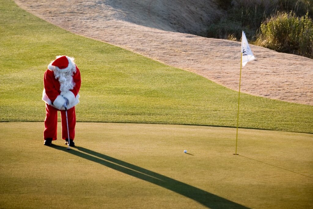 Santa playing golf at Wild Dunes